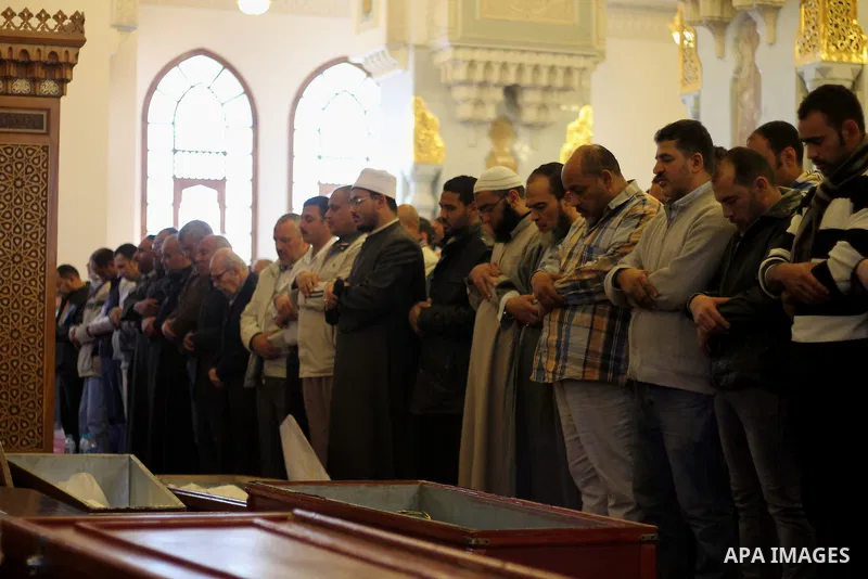 Egyptians pray in front of the body of Ahmed Seif al-Islam, son of Hassan al-Banna, founder of Egyptian Muslim Brotherhood during his funeral in Cairo, Egypt, on February. 05, 2016. Photo by Amr Sayed