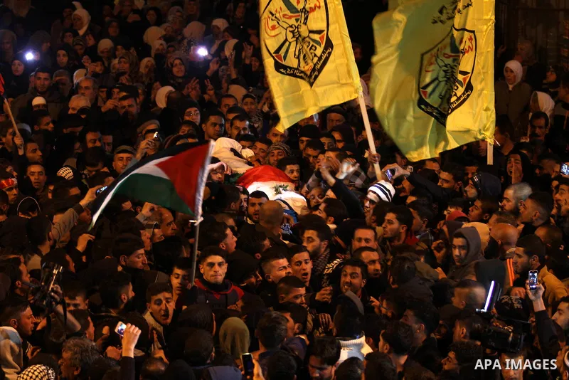 Mourners carry the body of one of the three Palestinians who were killed by Israeli security forces as they carried out a deadly attack in Jerusalem, during their funeral in the village of Qabatiya, near the West Bank ci...