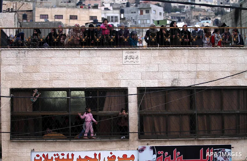 Palestinian women mourn during the funeral of three Palestinian who were killed by Israeli security forces as they carried out a deadly attack in Jerusalem, in the village of Qabatiya, near the West Bank city of Jenin, o...