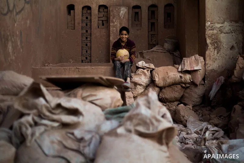 An Egyptian man works at a pottery workshop in Cairo, on February 6, 2016. Pottery is an ancient and traditional craft in Gaza. Local workshops usually produce products such as bowls, pitchers, flower pots, and vases. Ph...