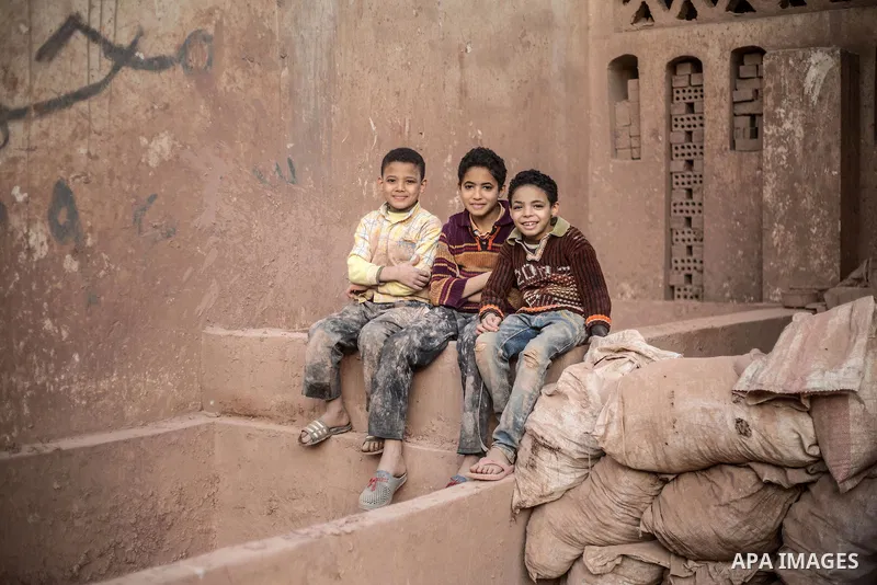 Egyptian boys, platy at a pottery workshop in Cairo, on February 6, 2016. Pottery is an ancient and traditional craft in Gaza. Local workshops usually produce products such as bowls, pitchers, flower pots, and vases. Pho...