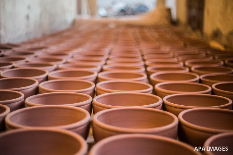 Pottery vessels are seen drying at a pottery workshop in Cairo, on February 6, 2016. Pottery is an ancient and traditional craft in Gaza. Local workshops usually produce products such as bowls, pitchers, flower pots, and...