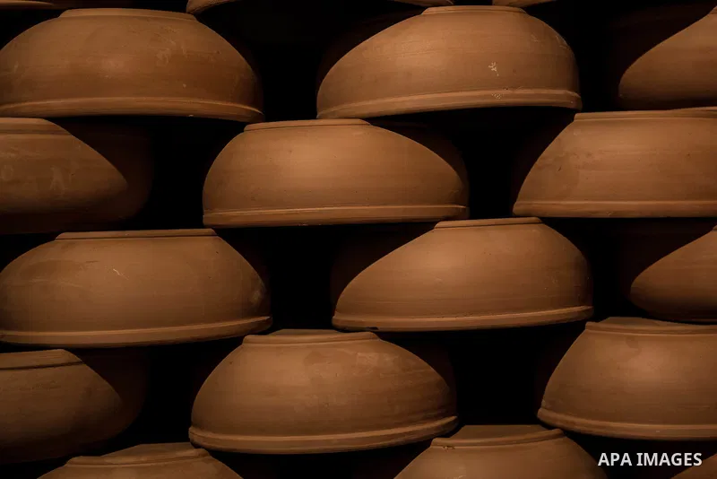 Pottery vessels are seen drying at a pottery workshop in Cairo, on February 6, 2016. Pottery is an ancient and traditional craft in Gaza. Local workshops usually produce products such as bowls, pitchers, flower pots, and...