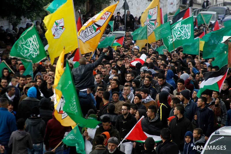 Mourners carry the body of Palestinian Haitham Al-Bau, who was shot and killed by Israeli soldiers, during his funeral, in the West Bank city of Hebron February 6, 2016. Israeli soldiers shot and killed Al-Bao, 17, in th...