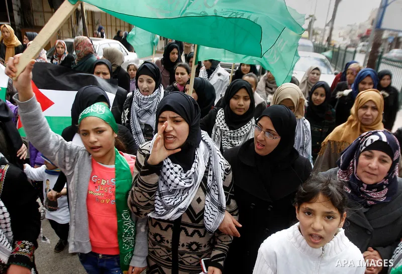 Mourners carry the body of Palestinian Haitham Al-Bau, who was shot and killed by Israeli soldiers, during his funeral, in the West Bank city of Hebron February 6, 2016. Israeli soldiers shot and killed Al-Bao, 17, in th...