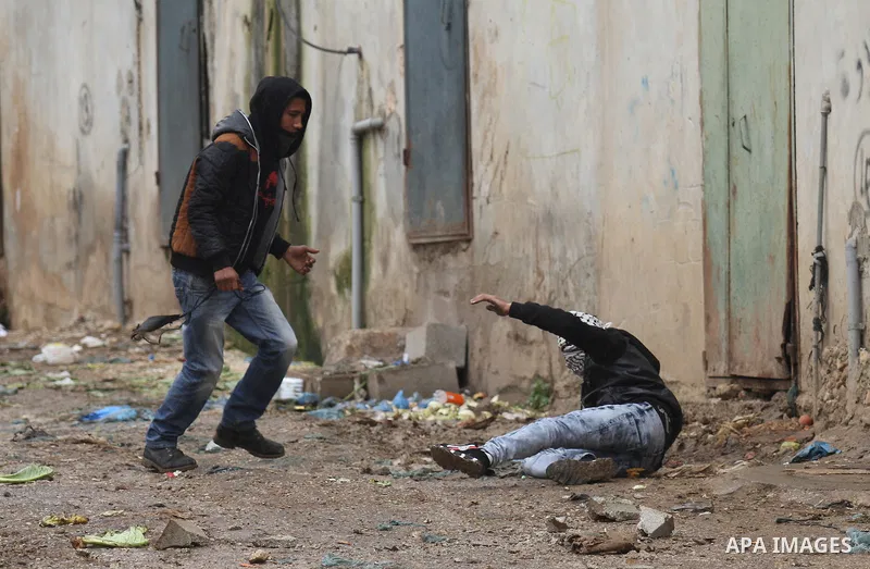 A Palestinian protester prepares his sling to hurl stones towards Israeli troops during clashes in the West Bank town of Qabatya, near Jenin February 6, 2016. On Wednesday, three young Palestinian men from Qabatya wieldi...