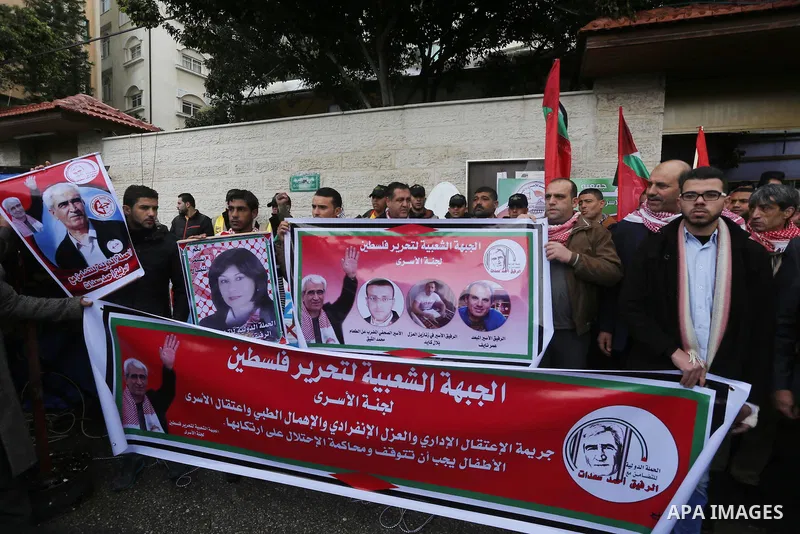 Palestinians take part in a protest demanding release the prisoners in Israeli jails, in front of Red cross office, in Gaza city, on February 8, 2016. Photo by Mohammed Asad