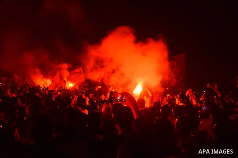 Al-Zamalek soccer club fans known as 'Ultras White Knights" light flares and shout slogans to mark the first anniversary of killing al-Zamalek fans in Cairo, Egypt, Feb. 08, 2016. At least 22 soccer fans were crushed to...