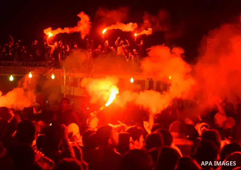 Al-Zamalek soccer club fans known as 'Ultras White Knights" light flares and shout slogans to mark the first anniversary of killing al-Zamalek fans in Cairo, Egypt, Feb. 08, 2016. At least 22 soccer fans were crushed to...