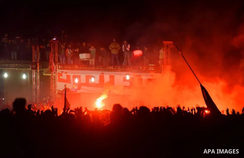 Al-Zamalek soccer club fans known as 'Ultras White Knights" light flares and shout slogans to mark the first anniversary of killing al-Zamalek fans in Cairo, Egypt, Feb. 08, 2016. At least 22 soccer fans were crushed to...