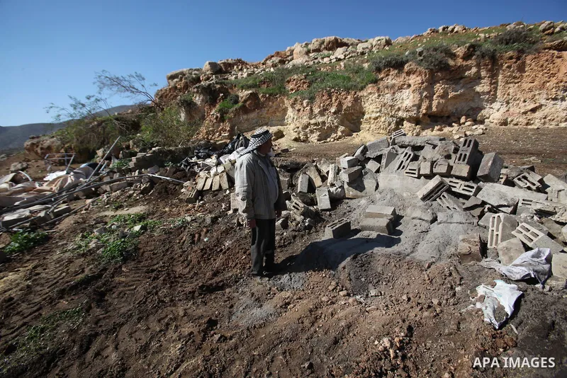 Palestinians inspect the rubble of a house that was demolished after Israeli authorities said it was built without a permit at Kherbet Tana, eastern the West Bank city of Nablus, on February 9, 2016. Photo by Nedal Eshta...