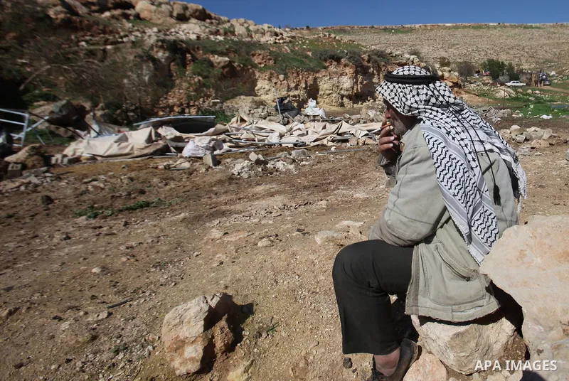Palestinians inspect the rubble of a house that was demolished after Israeli authorities said it was built without a permit at Kherbet Tana, eastern the West Bank city of Nablus, on February 9, 2016. Photo by Nedal Eshta...