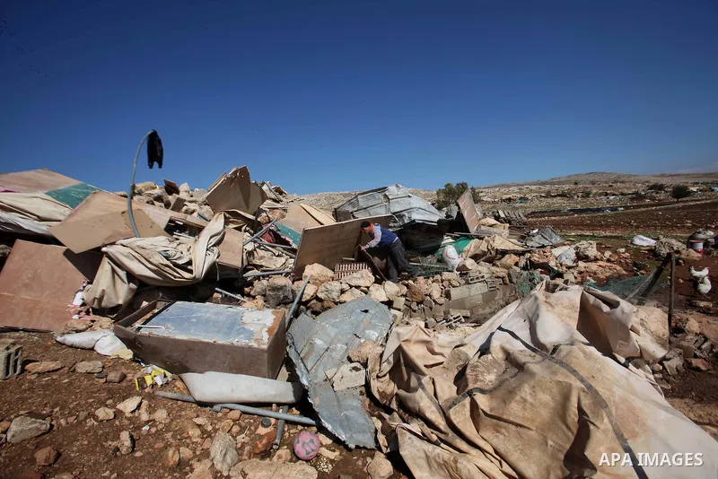 Palestinians inspect the rubble of a house that was demolished after Israeli authorities said it was built without a permit at Kherbet Tana, eastern the West Bank city of Nablus, on February 9, 2016. Photo by Nedal Eshta...