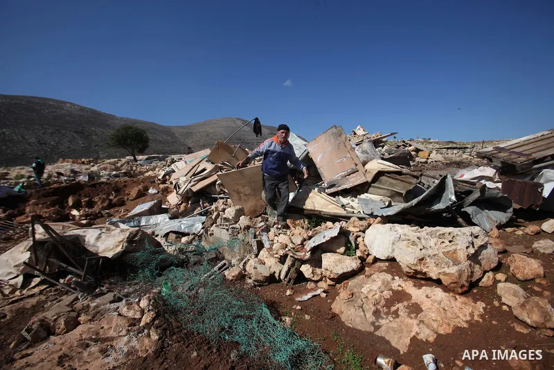 Palestinians inspect the rubble of a house that was demolished after Israeli authorities said it was built without a permit at Kherbet Tana, eastern the West Bank city of Nablus, on February 9, 2016. Photo by Nedal Eshta...