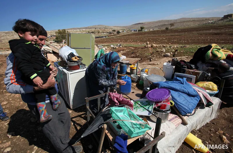 Palestinians inspect the rubble of a house that was demolished after Israeli authorities said it was built without a permit at Kherbet Tana, eastern the West Bank city of Nablus, on February 9, 2016. Photo by Nedal Eshta...