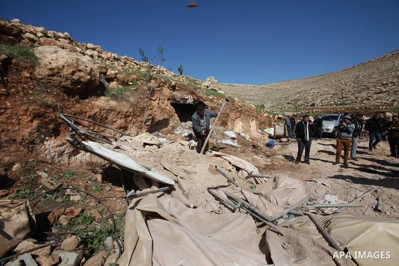 Palestinians inspect the rubble of a house that was demolished after Israeli authorities said it was built without a permit at Kherbet Tana, eastern the West Bank city of Nablus, on February 9, 2016. Photo by Nedal Eshta...