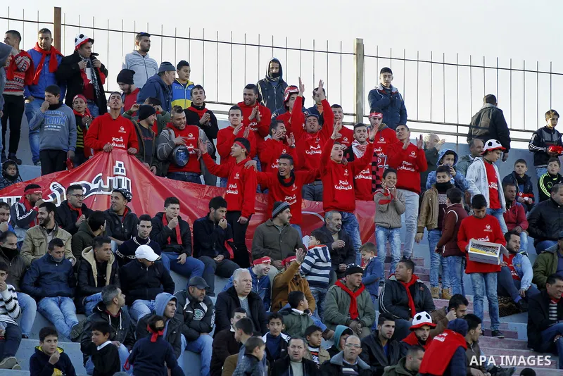 Fans attend the crucial AFC Champions League Playoff phase football match between Palestinian's Ahly Al-Khalil football team and FC Khujand team at Dura Stadium in the West Bank city of Hebron on Feb. 09, 2016. Mahmoud W...