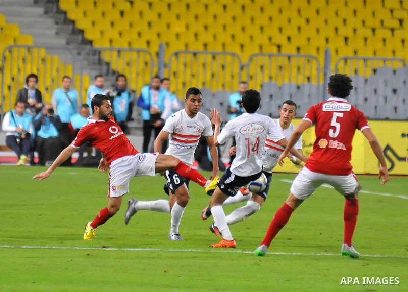 Al Ahly players compete against with Zamalek players during their Egyptian Premier League derby soccer match at Borg El Arab "Army Stadium" near Alexandria, Egypt, February 9, 2016. Photo by Amr Sayed