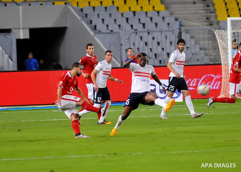 Al Ahly players compete against with Zamalek players during their Egyptian Premier League derby soccer match at Borg El Arab "Army Stadium" near Alexandria, Egypt, February 9, 2016. Photo by Amr Sayed