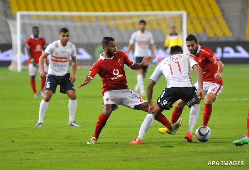 Al Ahly players compete against with Zamalek players during their Egyptian Premier League derby soccer match at Borg El Arab "Army Stadium" near Alexandria, Egypt, February 9, 2016. Photo by Amr Sayed