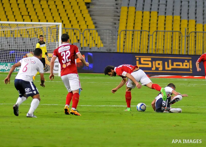 Al Ahly players compete against with Zamalek players during their Egyptian Premier League derby soccer match at Borg El Arab "Army Stadium" near Alexandria, Egypt, February 9, 2016. Photo by Amr Sayed