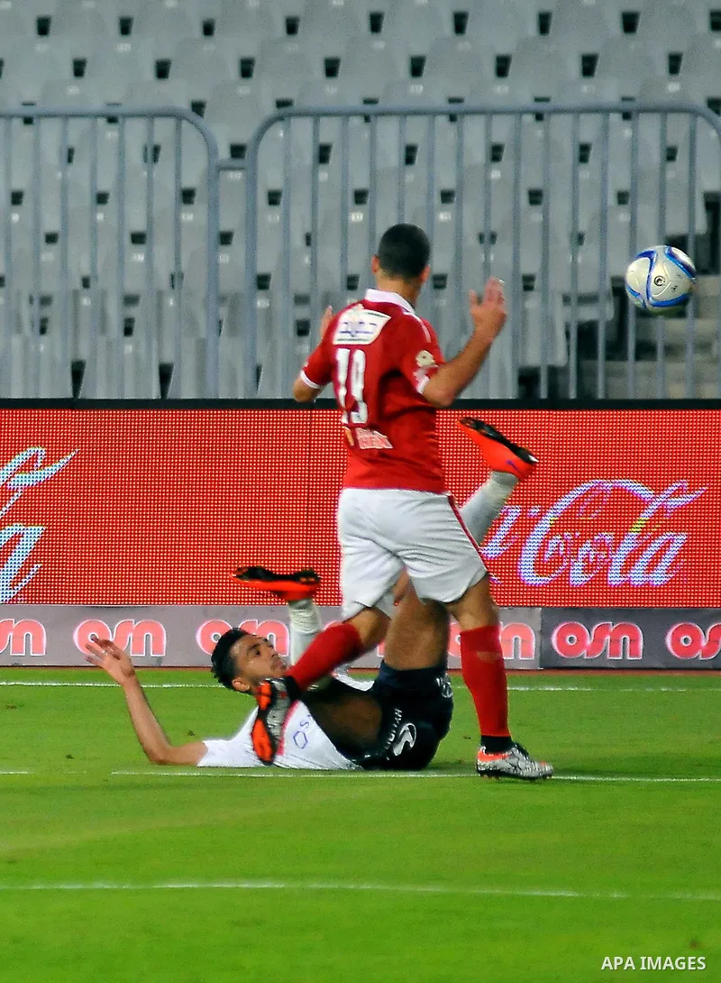 Al Ahly players compete against with Zamalek players during their Egyptian Premier League derby soccer match at Borg El Arab "Army Stadium" near Alexandria, Egypt, February 9, 2016. Photo by Amr Sayed
