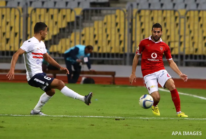 Al Ahly players compete against with Zamalek players during their Egyptian Premier League derby soccer match at Borg El Arab "Army Stadium" near Alexandria, Egypt, February 9, 2016. Photo by Amr Sayed