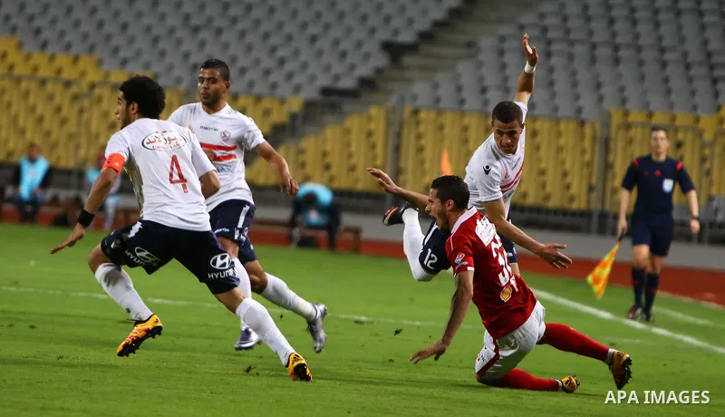 Al Ahly players compete against with Zamalek players during their Egyptian Premier League derby soccer match at Borg El Arab "Army Stadium" near Alexandria, Egypt, February 9, 2016. Photo by Amr Sayed