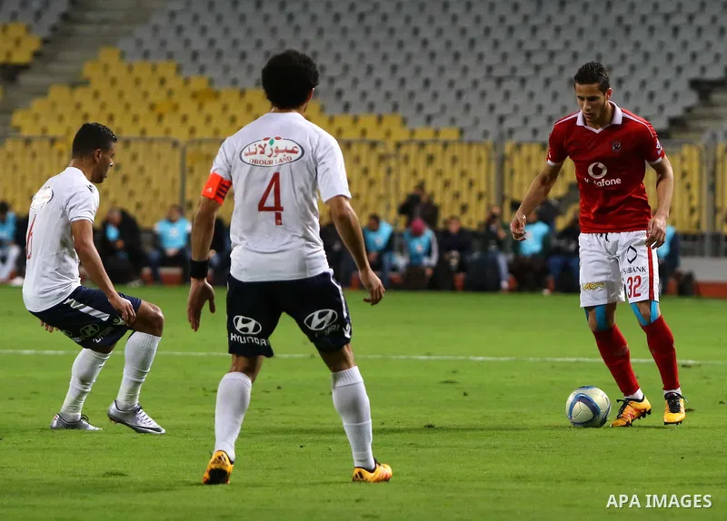 Al Ahly players compete against with Zamalek players during their Egyptian Premier League derby soccer match at Borg El Arab "Army Stadium" near Alexandria, Egypt, February 9, 2016. Photo by Amr Sayed