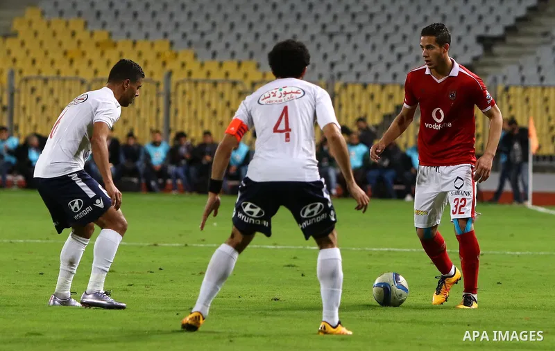 Al Ahly players compete against with Zamalek players during their Egyptian Premier League derby soccer match at Borg El Arab "Army Stadium" near Alexandria, Egypt, February 9, 2016. Photo by Amr Sayed