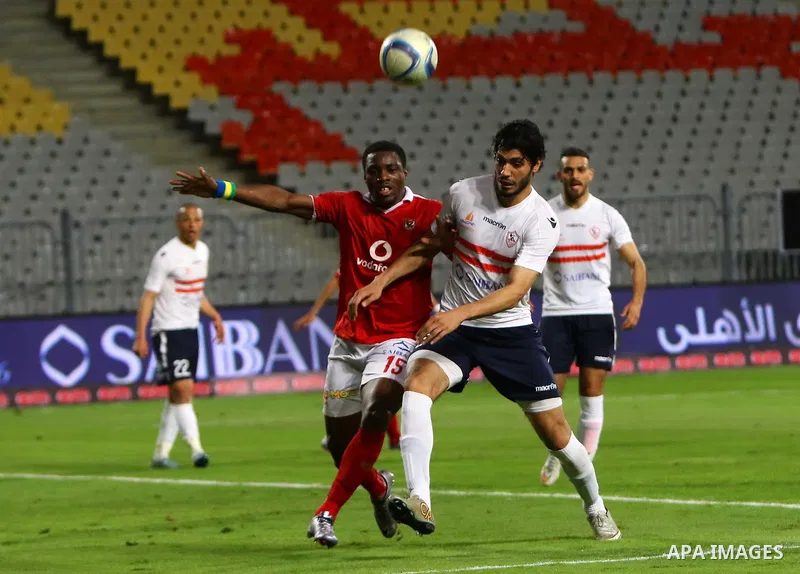 Al Ahly players compete against with Zamalek players during their Egyptian Premier League derby soccer match at Borg El Arab "Army Stadium" near Alexandria, Egypt, February 9, 2016. Photo by Amr Sayed