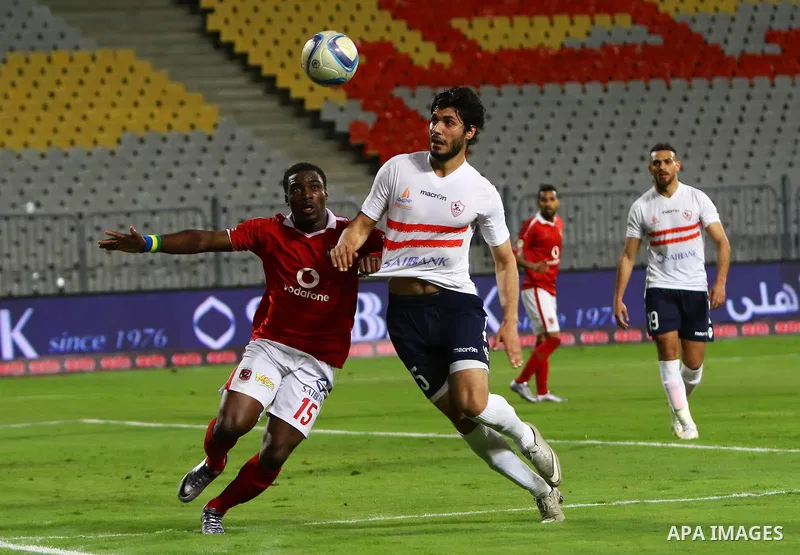 Al Ahly players compete against with Zamalek players during their Egyptian Premier League derby soccer match at Borg El Arab "Army Stadium" near Alexandria, Egypt, February 9, 2016. Photo by Amr Sayed