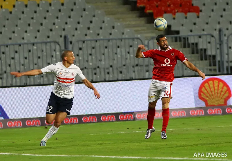Al Ahly players compete against with Zamalek players during their Egyptian Premier League derby soccer match at Borg El Arab "Army Stadium" near Alexandria, Egypt, February 9, 2016. Photo by Amr Sayed