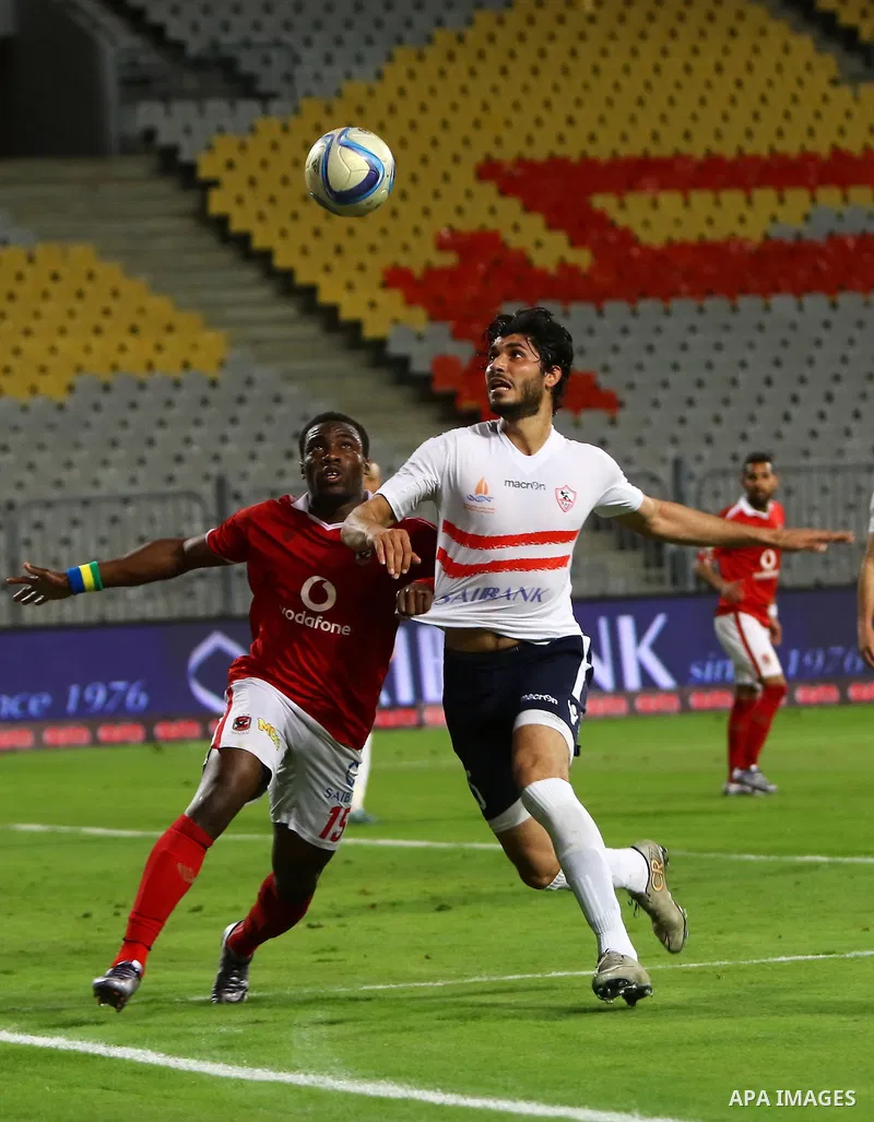 Al Ahly players compete against with Zamalek players during their Egyptian Premier League derby soccer match at Borg El Arab "Army Stadium" near Alexandria, Egypt, February 9, 2016. Photo by Amr Sayed