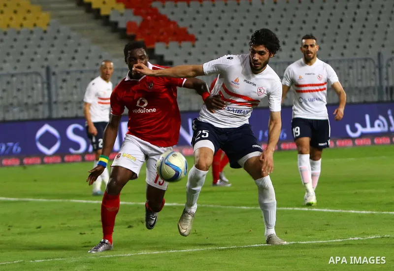 Al Ahly players compete against with Zamalek players during their Egyptian Premier League derby soccer match at Borg El Arab "Army Stadium" near Alexandria, Egypt, February 9, 2016. Photo by Amr Sayed