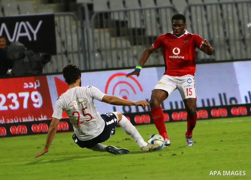 Al Ahly players compete against with Zamalek players during their Egyptian Premier League derby soccer match at Borg El Arab "Army Stadium" near Alexandria, Egypt, February 9, 2016. Photo by Amr Sayed