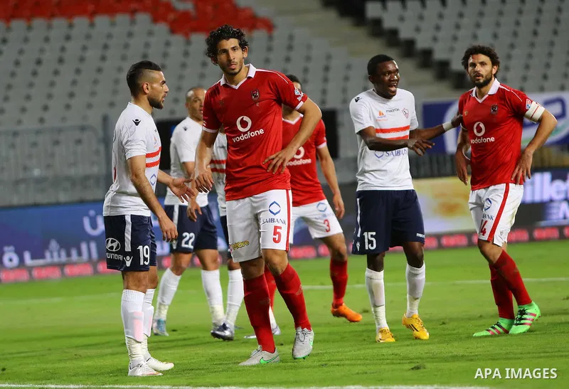 Al Ahly players compete against with Zamalek players during their Egyptian Premier League derby soccer match at Borg El Arab "Army Stadium" near Alexandria, Egypt, February 9, 2016. Photo by Amr Sayed