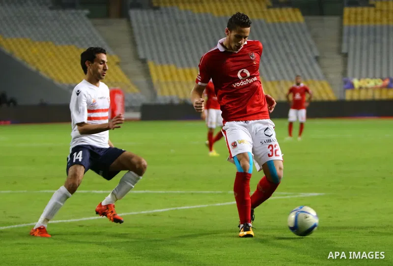 Al Ahly players compete against with Zamalek players during their Egyptian Premier League derby soccer match at Borg El Arab "Army Stadium" near Alexandria, Egypt, February 9, 2016. Photo by Amr Sayed