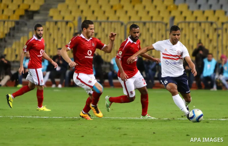 Al Ahly players compete against with Zamalek players during their Egyptian Premier League derby soccer match at Borg El Arab "Army Stadium" near Alexandria, Egypt, February 9, 2016. Photo by Amr Sayed