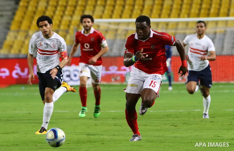 Al Ahly players compete against with Zamalek players during their Egyptian Premier League derby soccer match at Borg El Arab "Army Stadium" near Alexandria, Egypt, February 9, 2016. Photo by Amr Sayed
