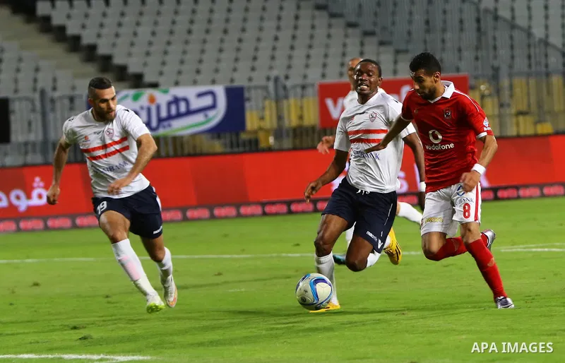 Al Ahly players compete against with Zamalek players during their Egyptian Premier League derby soccer match at Borg El Arab "Army Stadium" near Alexandria, Egypt, February 9, 2016. Photo by Amr Sayed