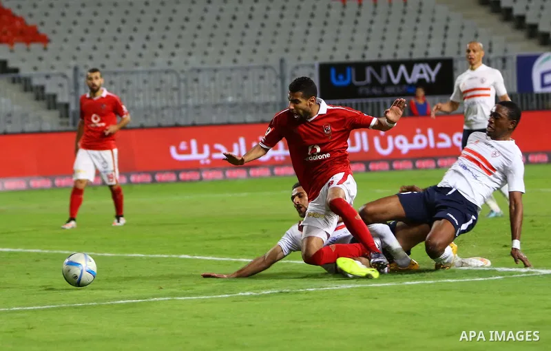 Al Ahly players compete against with Zamalek players during their Egyptian Premier League derby soccer match at Borg El Arab "Army Stadium" near Alexandria, Egypt, February 9, 2016. Photo by Amr Sayed