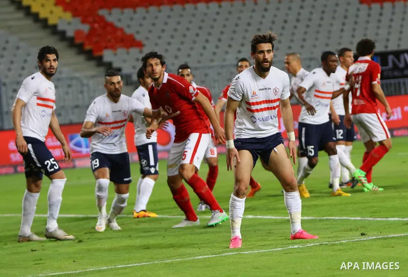 Al Ahly players compete against with Zamalek players during their Egyptian Premier League derby soccer match at Borg El Arab "Army Stadium" near Alexandria, Egypt, February 9, 2016. Photo by Amr Sayed