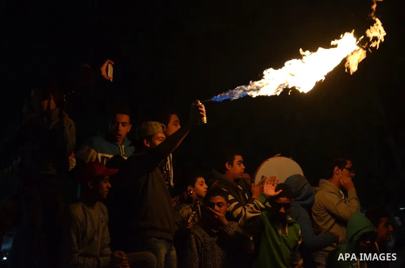 Fans of Al Ahly football club celebrate after their Egyptian Premier League derby soccer match against El Zamalek at Borg El Arab "Army Stadium" near Alexandria, Egypt, February 9, 2016. Photo by Amr Sayed