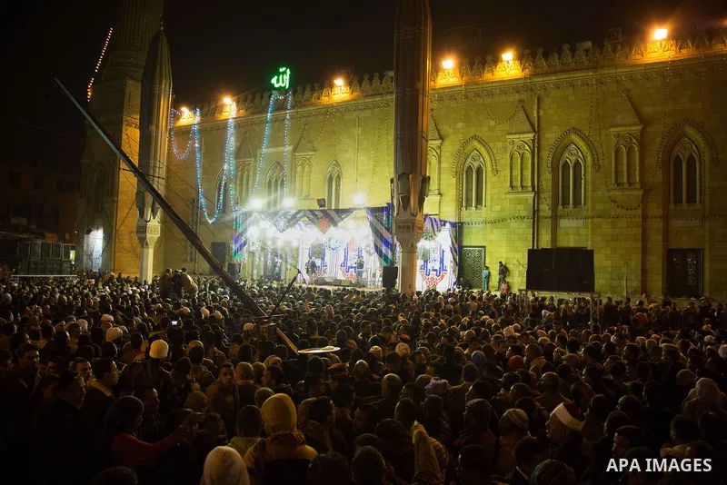 Egyptians celebrate Moulid al-Hussein, a Sufi gathering which commemorates the birth of the Muslim Prophet Muhammad's grandson, in Cairo, Egypt. The event attracts thousands of Muslims from all over the country to the mo...