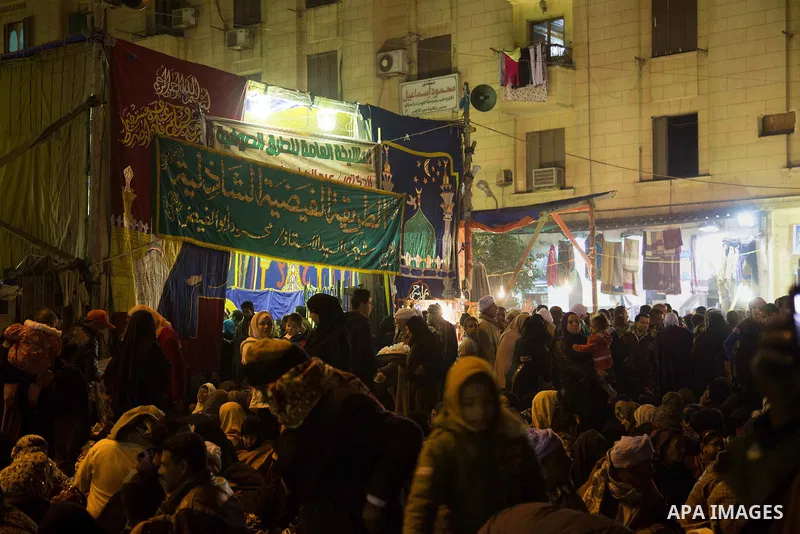 Egyptians celebrate Moulid al-Hussein, a Sufi gathering which commemorates the birth of the Muslim Prophet Muhammad's grandson, in Cairo, Egypt. The event attracts thousands of Muslims from all over the country to the mo...