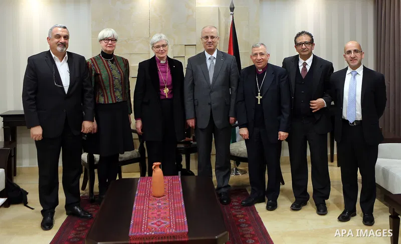 Palestinian Prime Minister Rami Hamdallah meets with a head of the bishops of Sweden Antti Yakleen in the West Bank city of Ramallah, on Feb. 11, 2016. Photo by Prime Minister Office