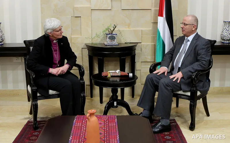 Palestinian Prime Minister Rami Hamdallah meets with a head of the bishops of Sweden Antti Yakleen in the West Bank city of Ramallah, on Feb. 11, 2016. Photo by Prime Minister Office