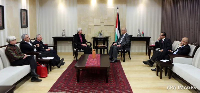 Palestinian Prime Minister Rami Hamdallah meets with a head of the bishops of Sweden Antti Yakleen in the West Bank city of Ramallah, on Feb. 11, 2016. Photo by Prime Minister Office