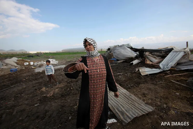 A Palestinian woman inspects the rubble of her house that were demolished by the Israeli army, in the Jordan valley, near the West Bank town of Tubas on February 11, 2016. Israel is planning to annex the Jordan Valley in...